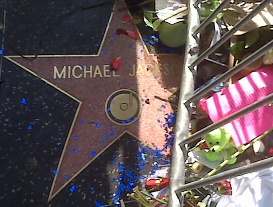 Flowers and candles left in tribute beside Michael Jackson's star on the Hollywood Walk of Fame